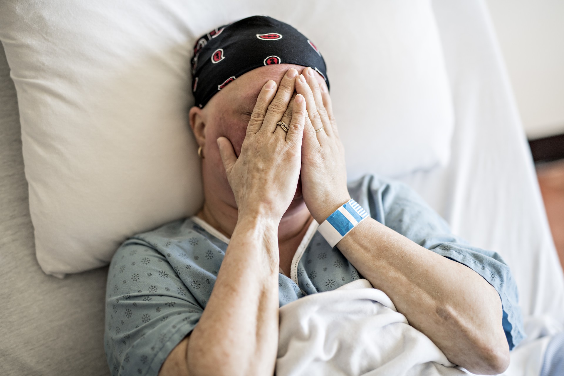 A woman in hospital bed suffering from cancer