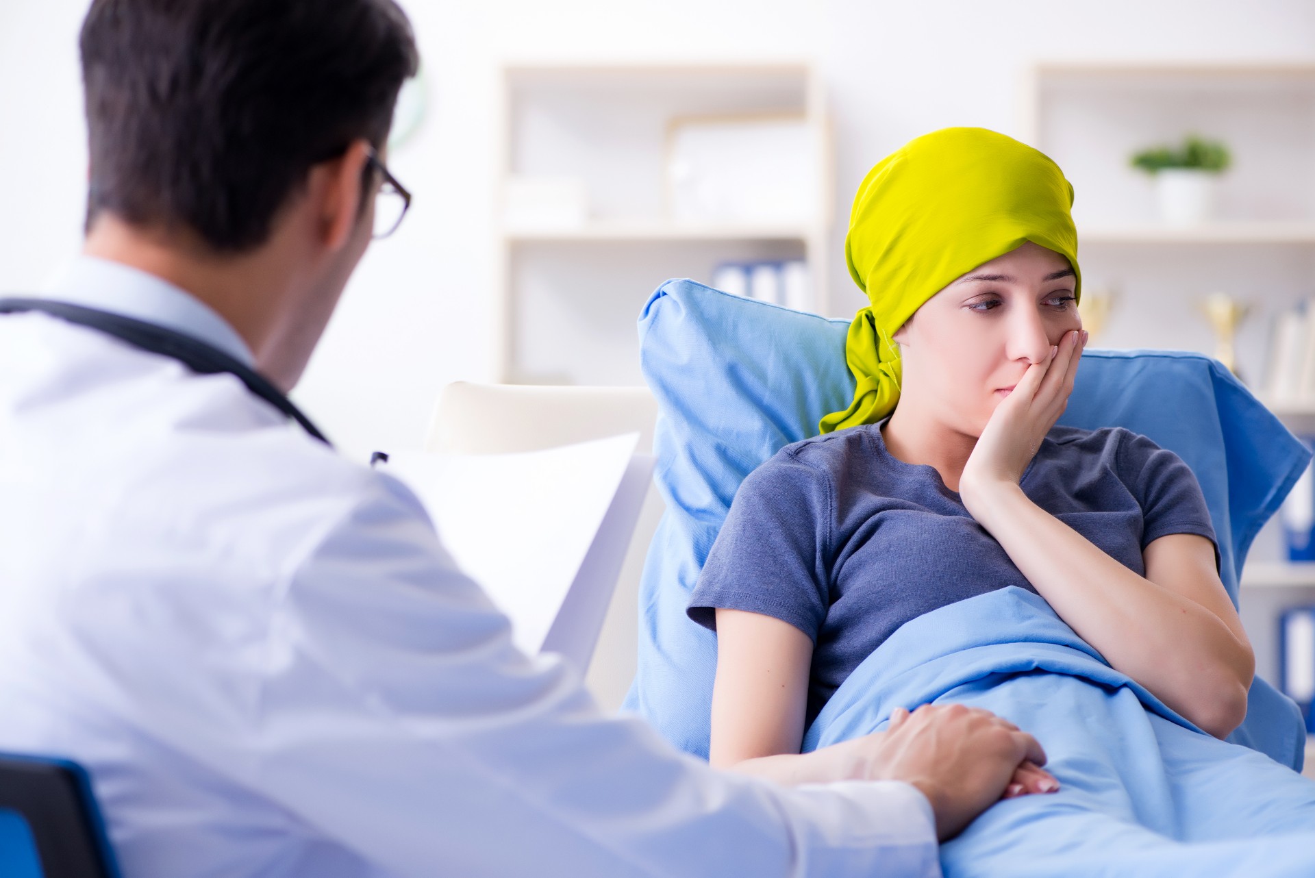 Cancer patient visiting doctor for medical consultation in clinic
