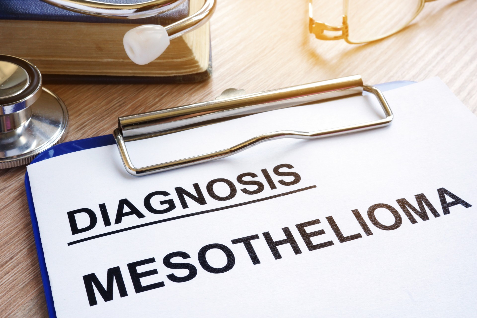 Diagnosis Mesothelioma and stethoscope on a desk.