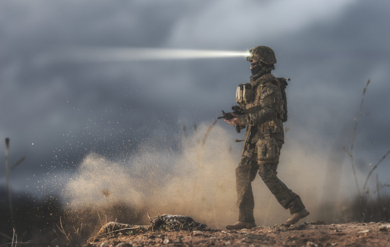 Soldier walking on the battlefield. It´s a doll